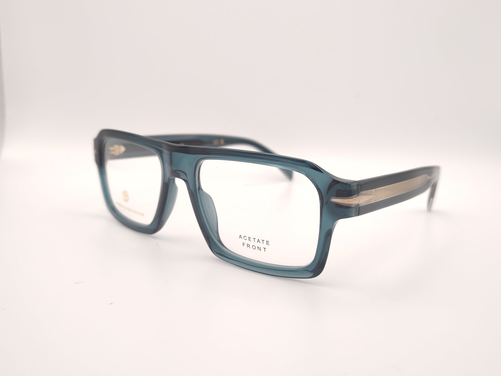gafas graduadas rectangulares de acetato azul petróleo translúcido con detalle metálico en las varillas