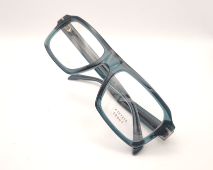 gafas graduadas rectangulares de acetato azul petróleo translúcido con detalle metálico en las varillas