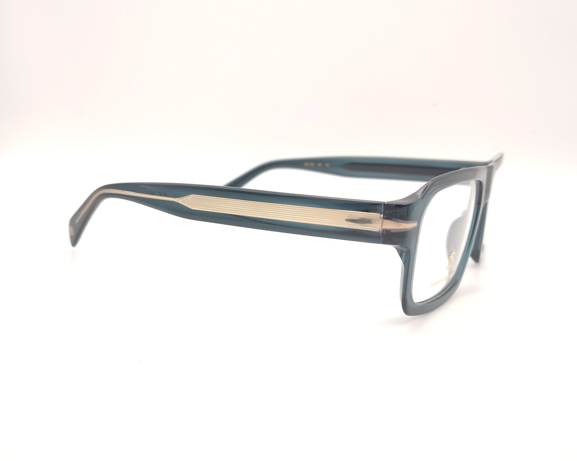 gafas graduadas rectangulares de acetato azul petróleo translúcido con detalle metálico en las varillas
