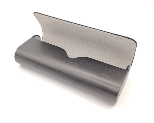 estuche para gafas rígido negro abierto con interior gris claro y textura suave