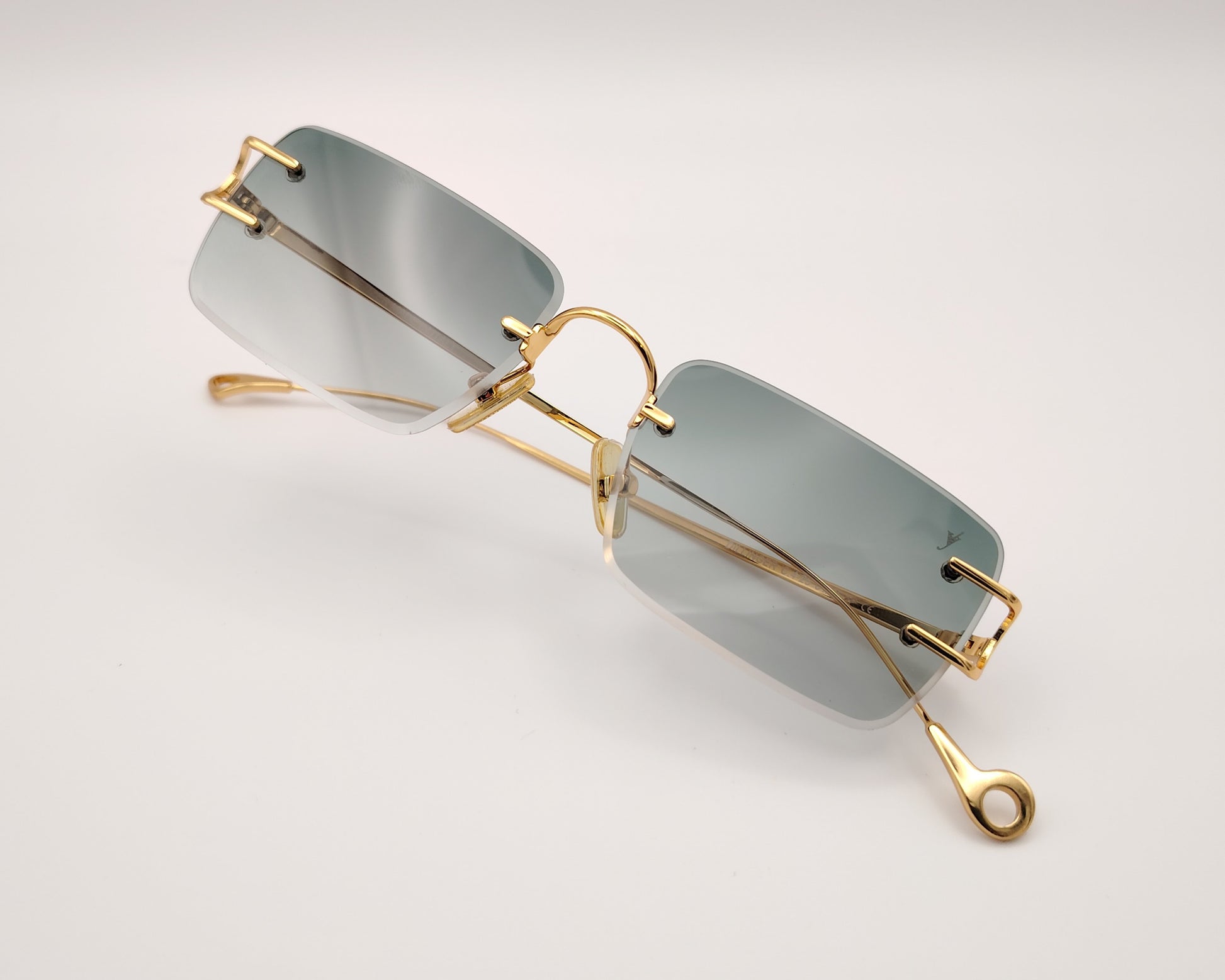 eyepetizer dillinger c 4-25 gafas de sol sin montura con lentes rectangulares degradadas en verde detalles metálicos dorados