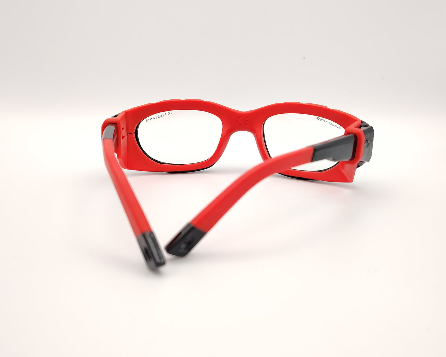 gafas de protección deportiva para niños con montura envolvente y cinta ajustable