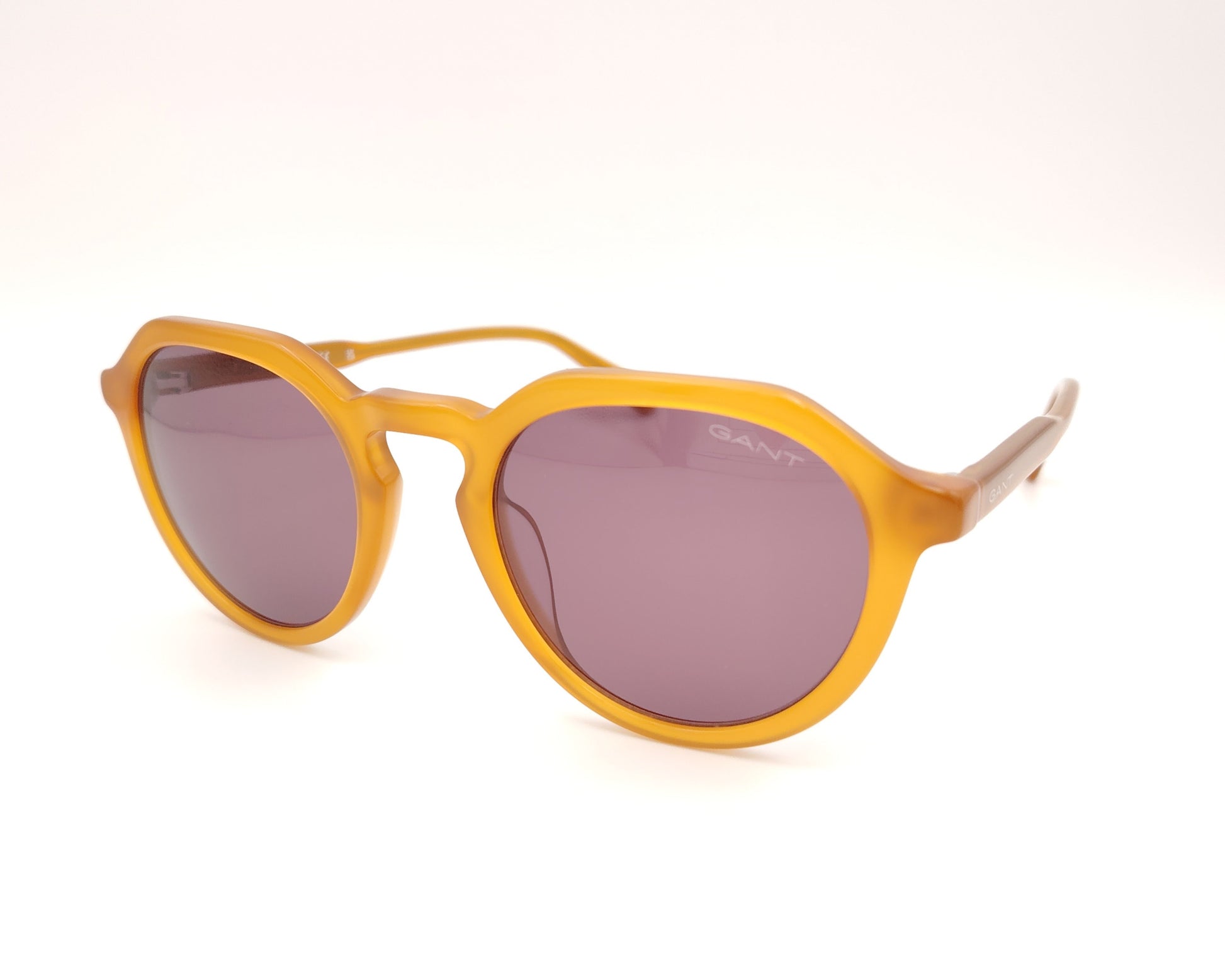 gafas de sol gant forma redonda en acetato color miel con lentes oscuras marrones