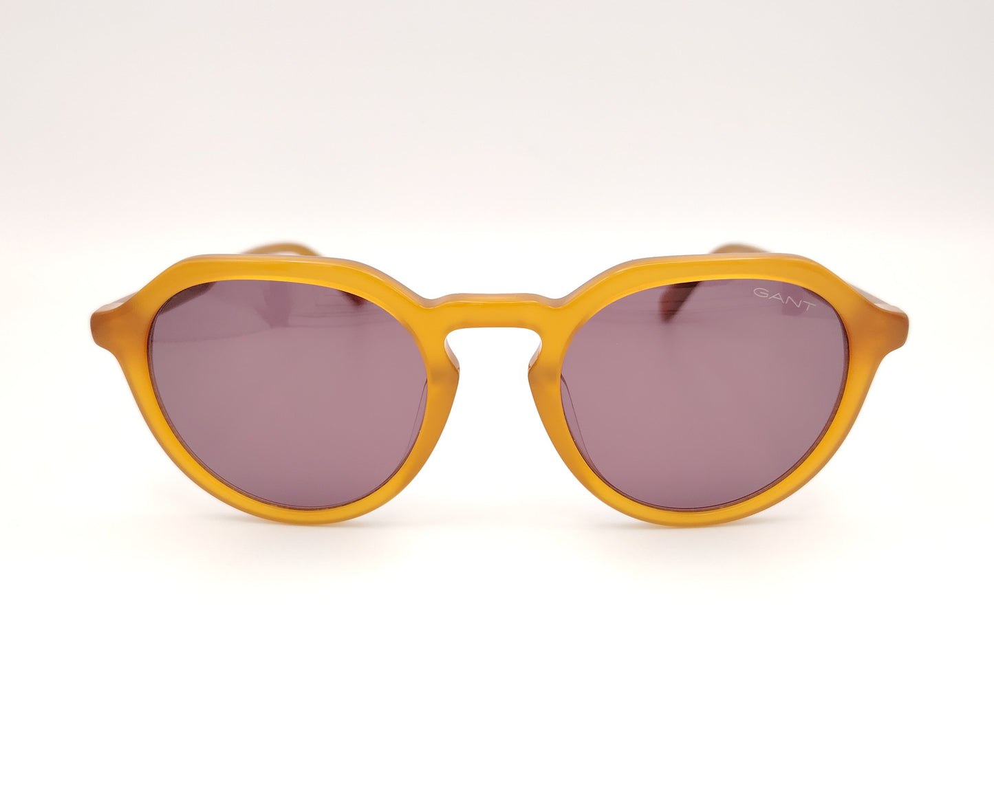 gafas de sol gant forma redonda en acetato color miel con lentes oscuras marrones