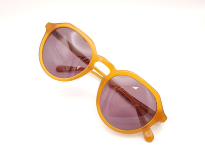 gafas de sol gant forma redonda en acetato color miel con lentes oscuras marrones