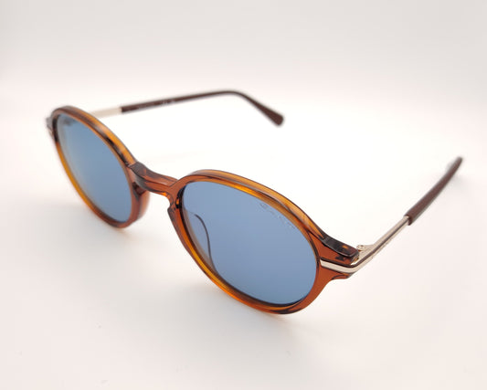 gafas de sol redondas con montura carey marrón y lentes azules