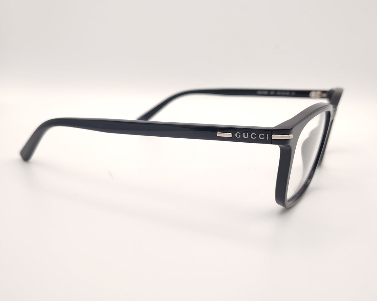 gafas gucci negras rectangulares con logo metálico en las varillas