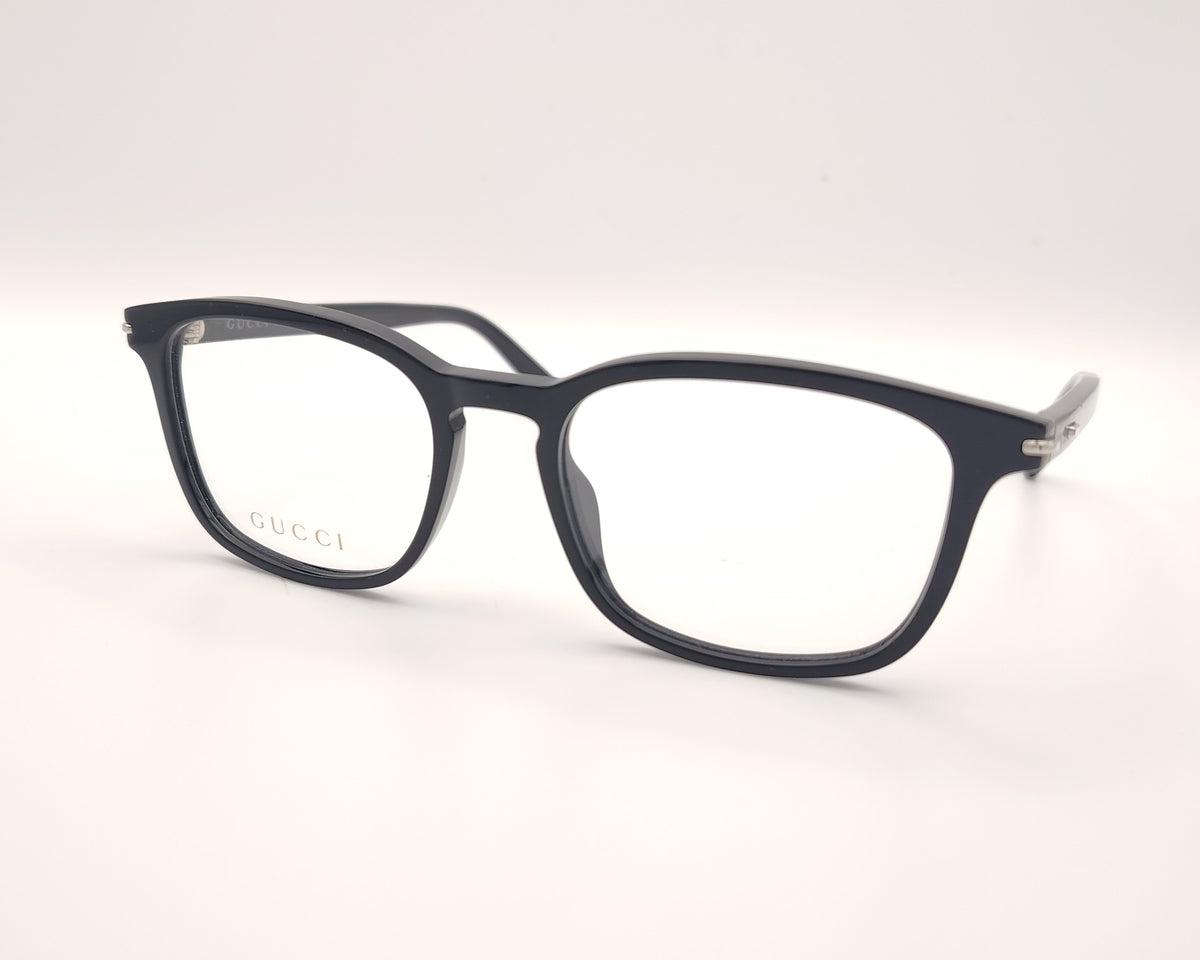 gafas gucci negras rectangulares con logo metálico en las varillas