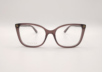 gafas gucci color malva con forma mariposa y detalles dorados
