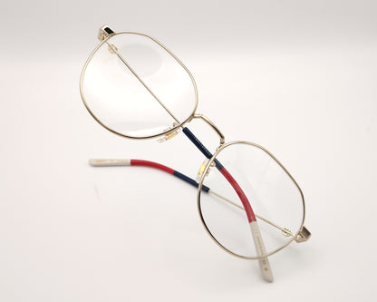 gafas gucci metálicas doradas con forma redonda y varillas en rojo azul y beige
