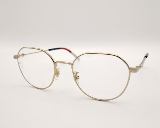gafas gucci metálicas doradas con forma redonda y varillas en rojo azul y beige