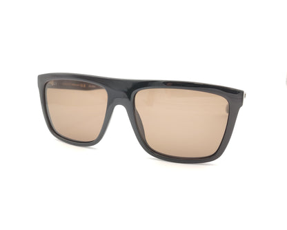 gafas de sol gucci con montura negra ancha y lentes marrones de forma cuadrada