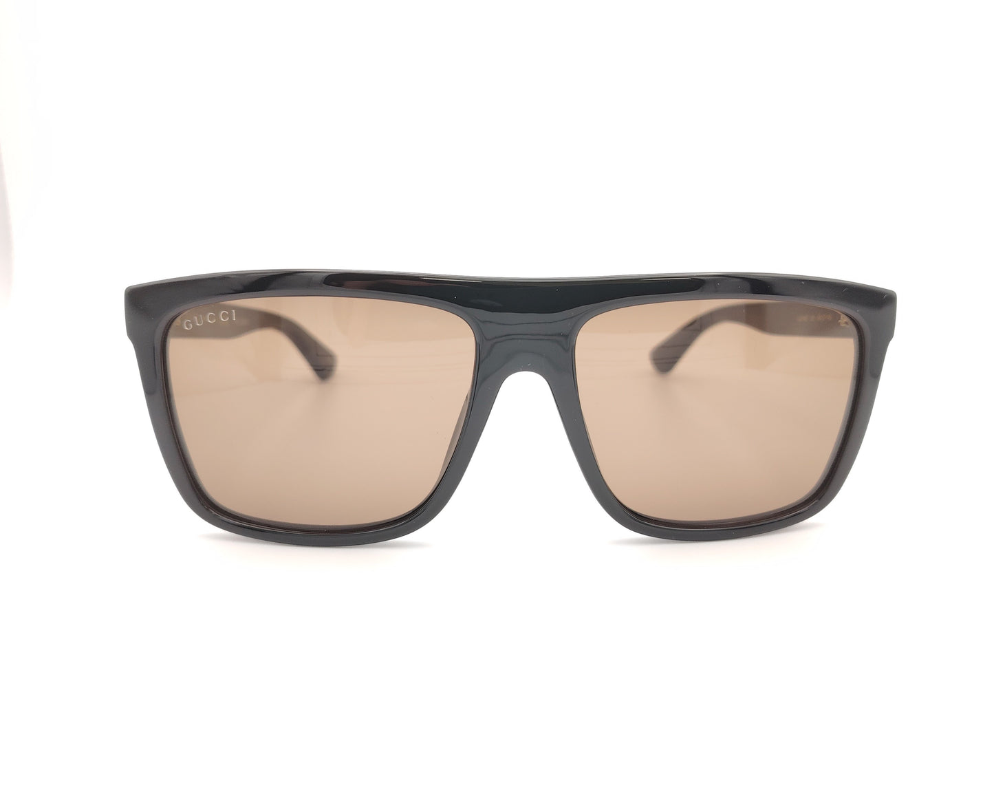 gafas de sol gucci con montura negra ancha y lentes marrones de forma cuadrada