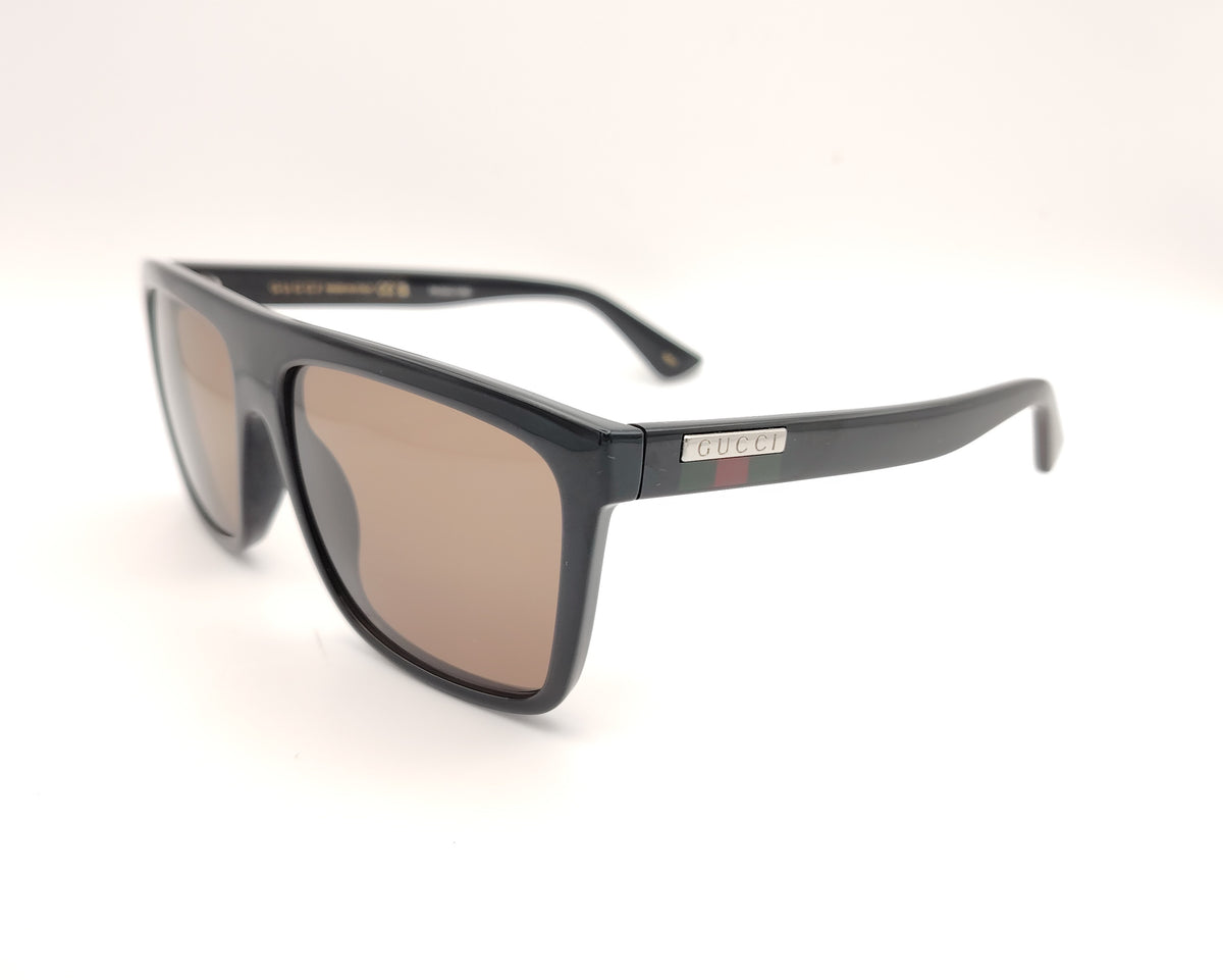 gafas de sol guci gg0748s  de pasta negra con cristales marrones y logo en las varillas