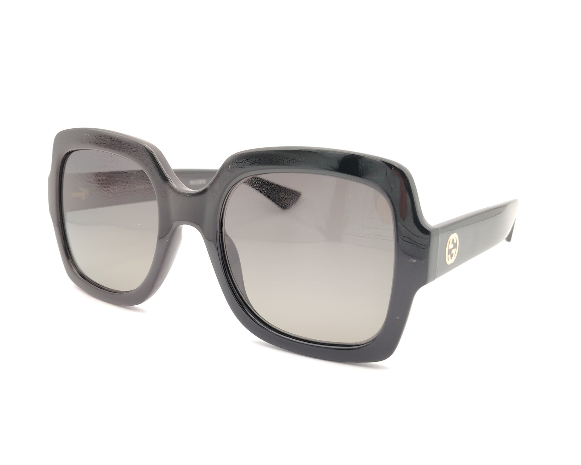 gafas de sol gucci negras con montura cuadrada oversize y logo dorado en la varilla
