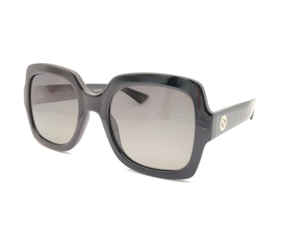 gafas de sol gucci negras con montura cuadrada oversize y logo dorado en la varilla