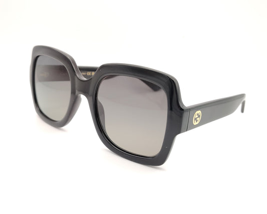 gafas de sol gucci negras con montura cuadrada oversize y logo dorado en la varilla