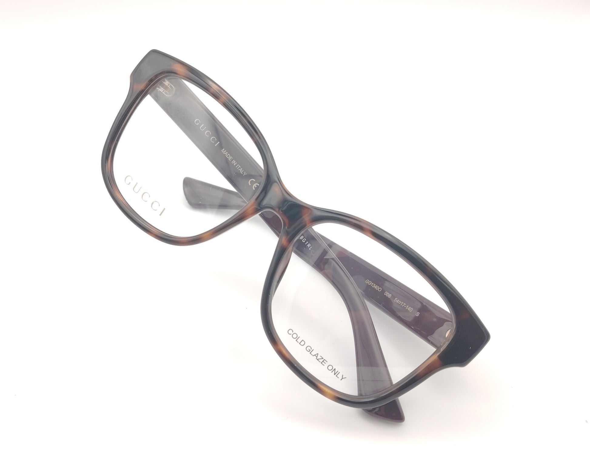gafas graduadas gucci con frontal carey y patillas berenjena con logo dorado