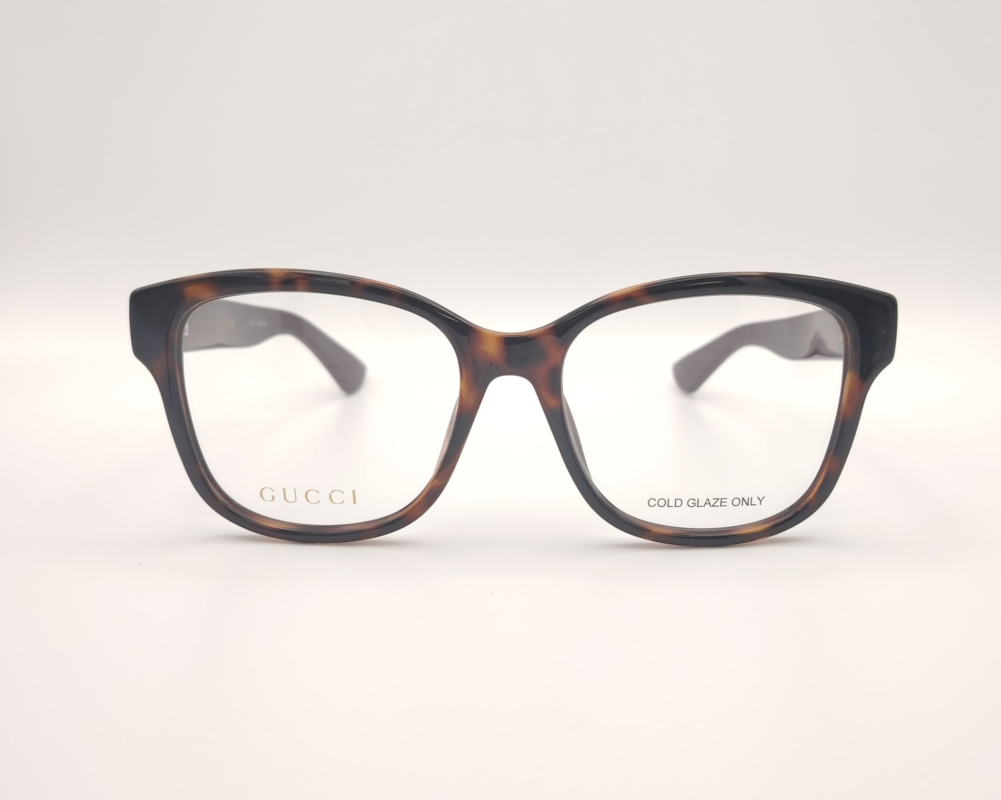 gafas graduadas gucci con frontal carey y patillas berenjena con logo dorado