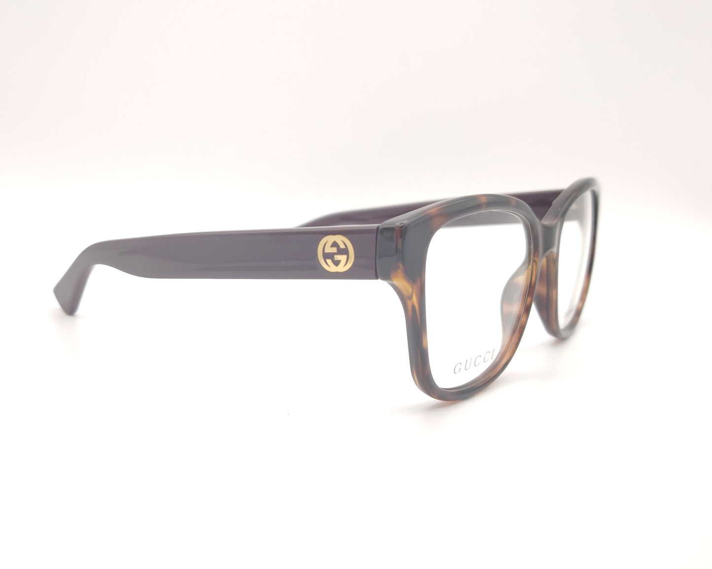 gafas graduadas gucci con frontal carey y patillas berenjena con logo dorado