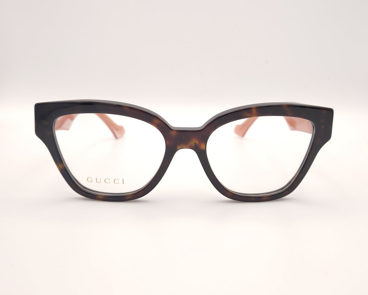 gafas gucci en acetato carey con varillas rosas y logo gg dorado