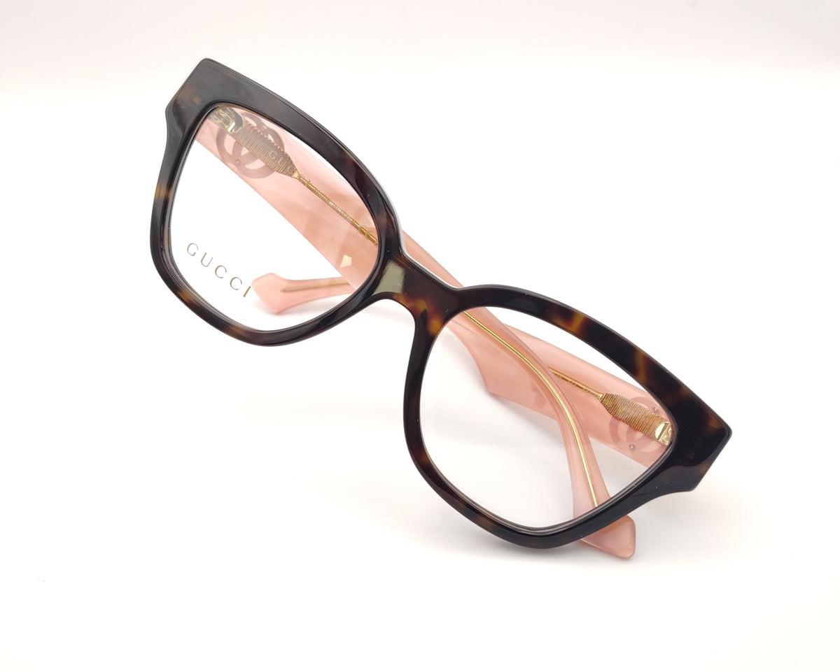 gafas gucci en acetato carey con varillas rosas y logo gg dorado