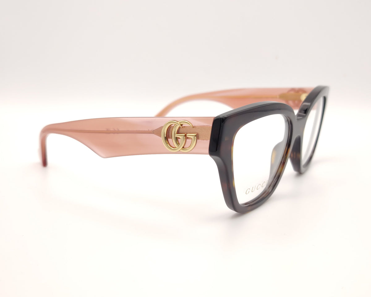 gafas gucci en acetato carey con varillas rosas y logo gg dorado