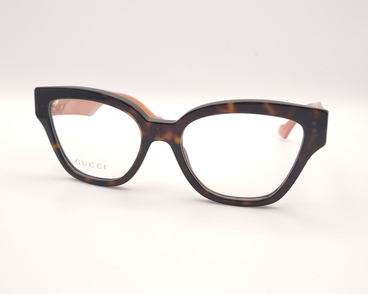 gafas gucci en acetato carey con varillas rosas y logo gg dorado