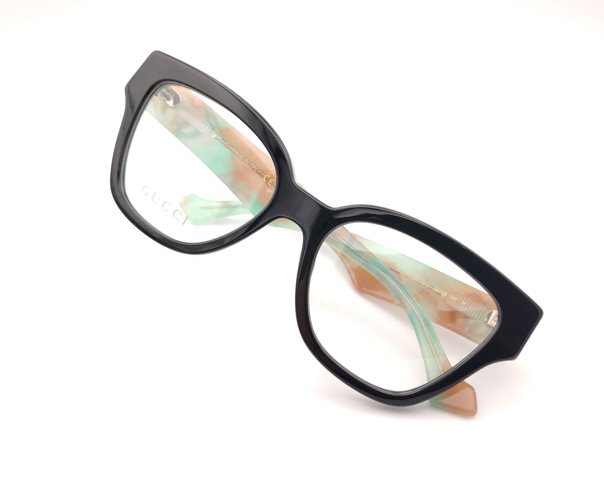 gafas gucci en acetato carey con varillas en verde y beige y logo gg plateado