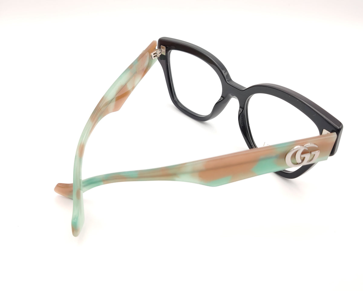 gafas gucci en acetato carey con varillas en verde y beige y logo gg plateado