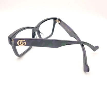 gafas gucci negras rectangulares con varilla jaspeada en verde y morado y logo dorado gg