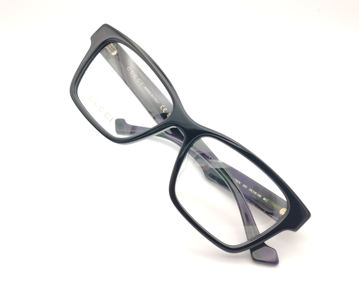 gafas gucci negras rectangulares con varilla jaspeada en verde y morado y logo dorado gg