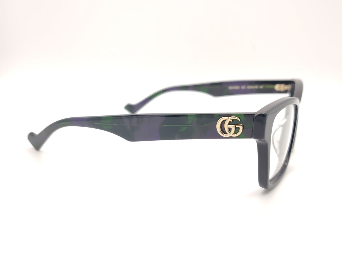 gafas gucci negras rectangulares con varilla jaspeada en verde y morado y logo dorado gg