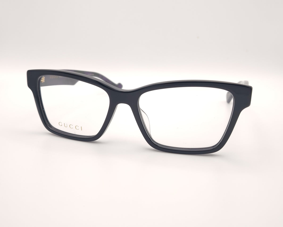 gafas gucci negras rectangulares con varilla jaspeada en verde y morado y logo dorado gg