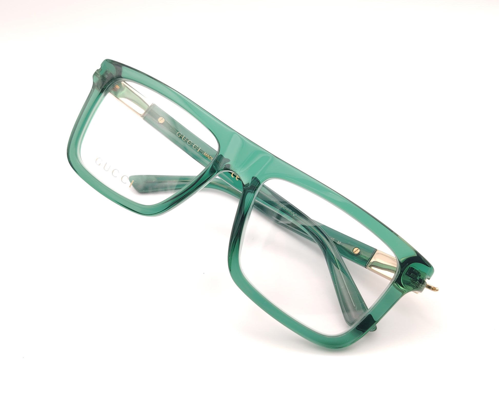 gafas graduadas gucci verdes con montura cuadrada y detalle dorado en la varilla