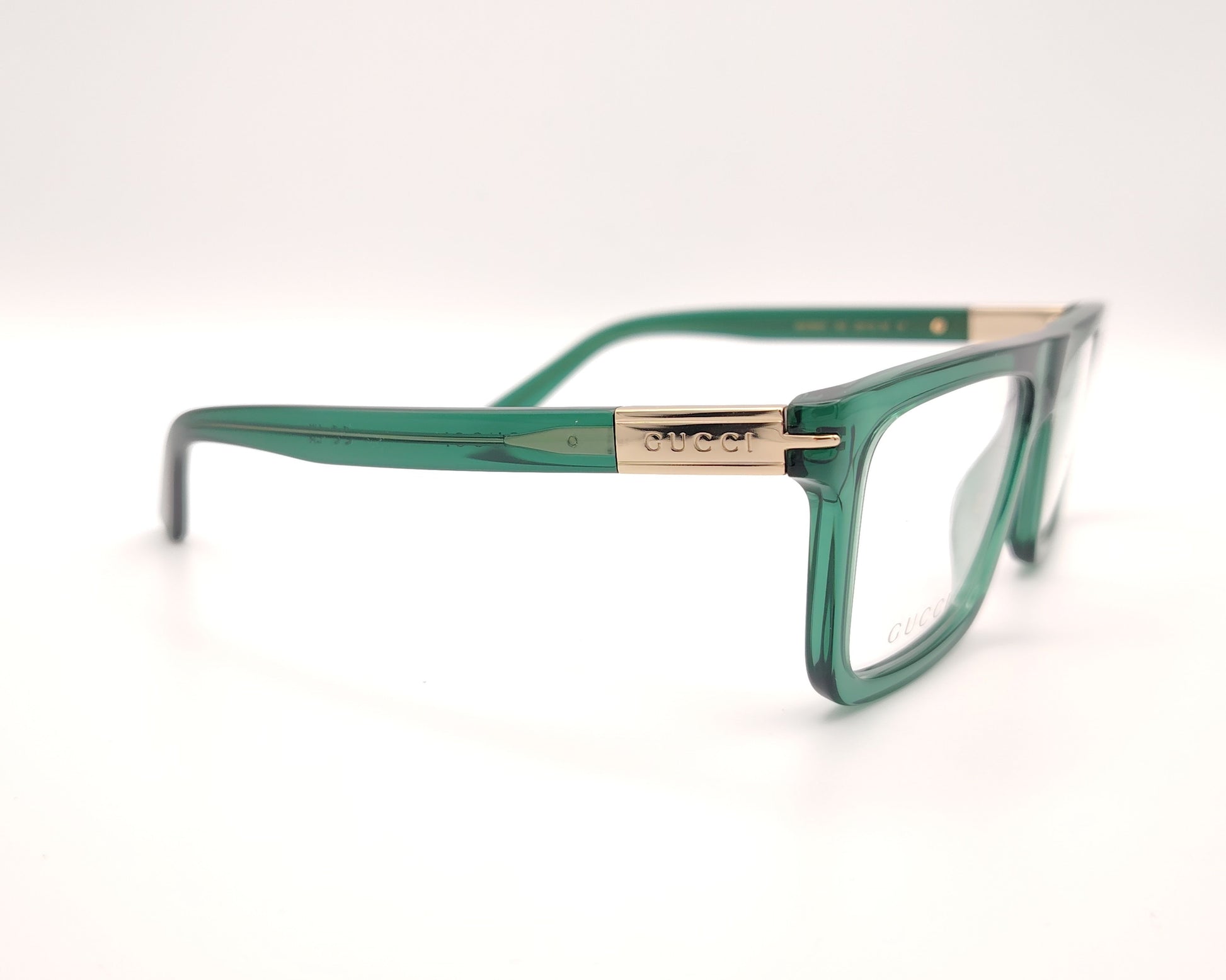 gafas graduadas gucci verdes con montura cuadrada y detalle dorado en la varilla