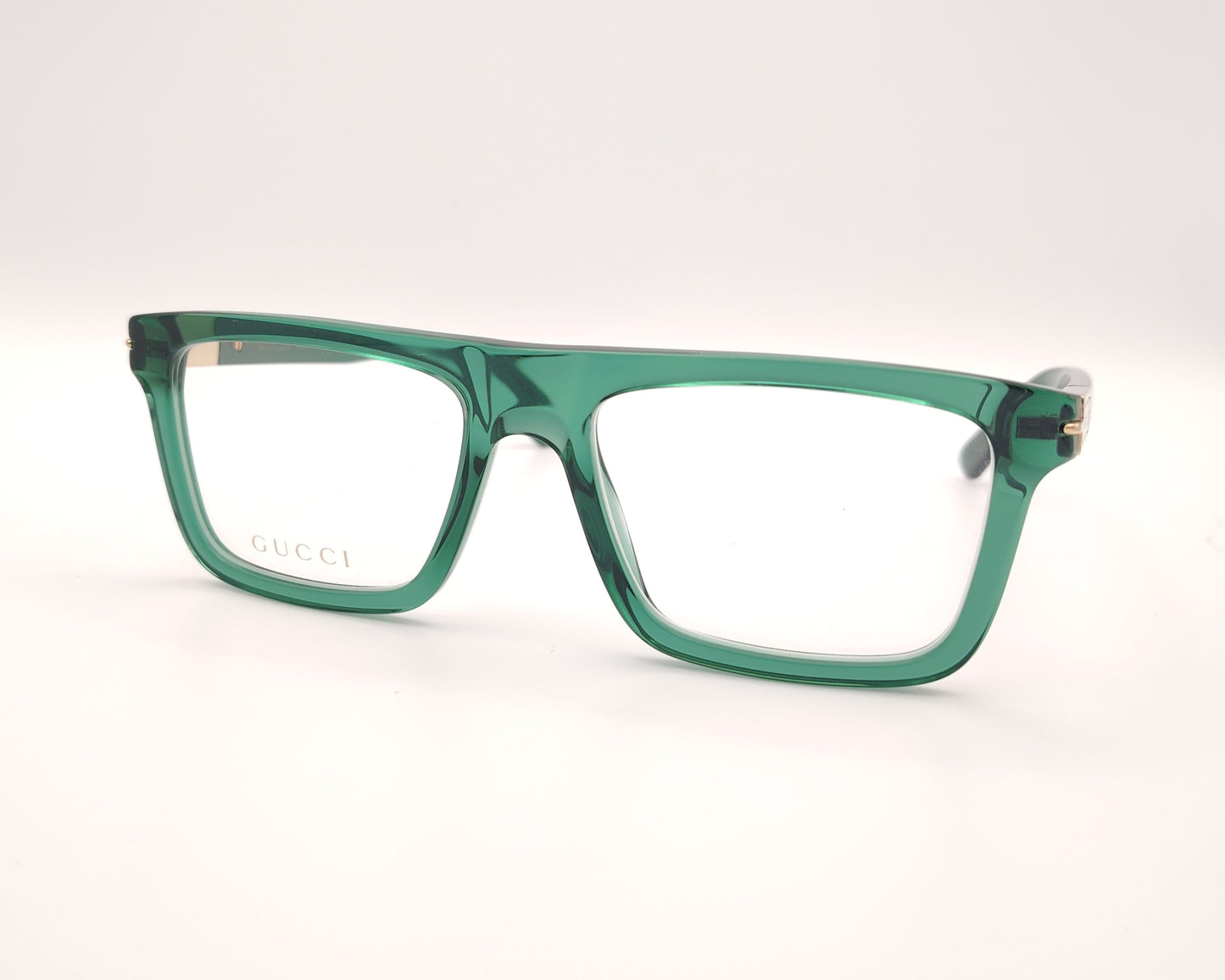 gafas graduadas gucci verdes con montura cuadrada y detalle dorado en la varilla