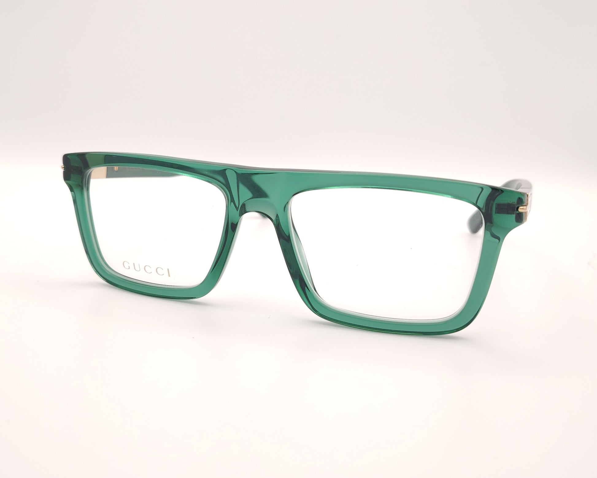 gafas graduadas gucci verdes con montura cuadrada y detalle dorado en la varilla