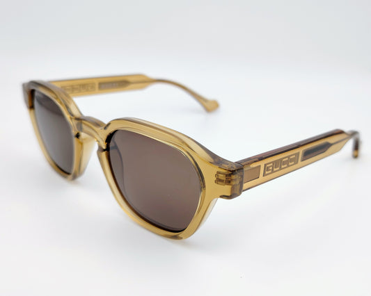 gucci gg1730s 003 gafas de sol estilo retro de acetato en color ocre traslúcido con lentes en marrón y logo en las varillas
