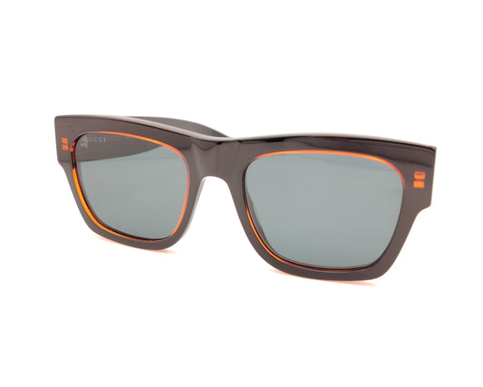 gafas de sol gucci negras con marco grueso y detalles en naranja translúcido

