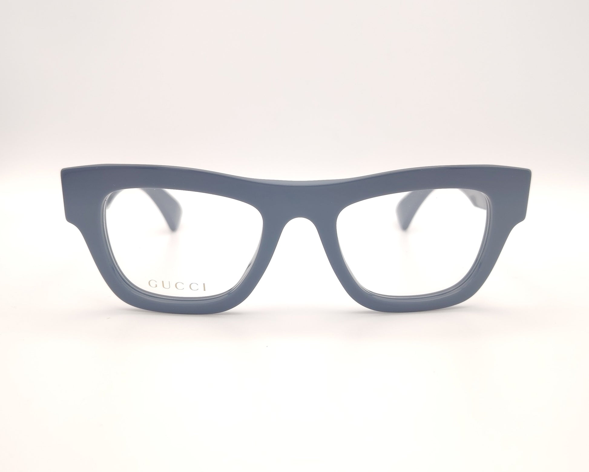 gafas graduadas gucci color azul grisáceo con montura gruesa y logo metálico en la varilla

