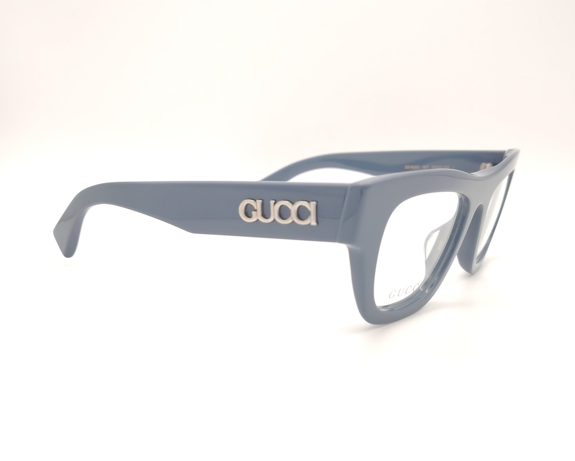 gafas graduadas gucci color azul grisáceo con montura gruesa y logo metálico en la varilla

