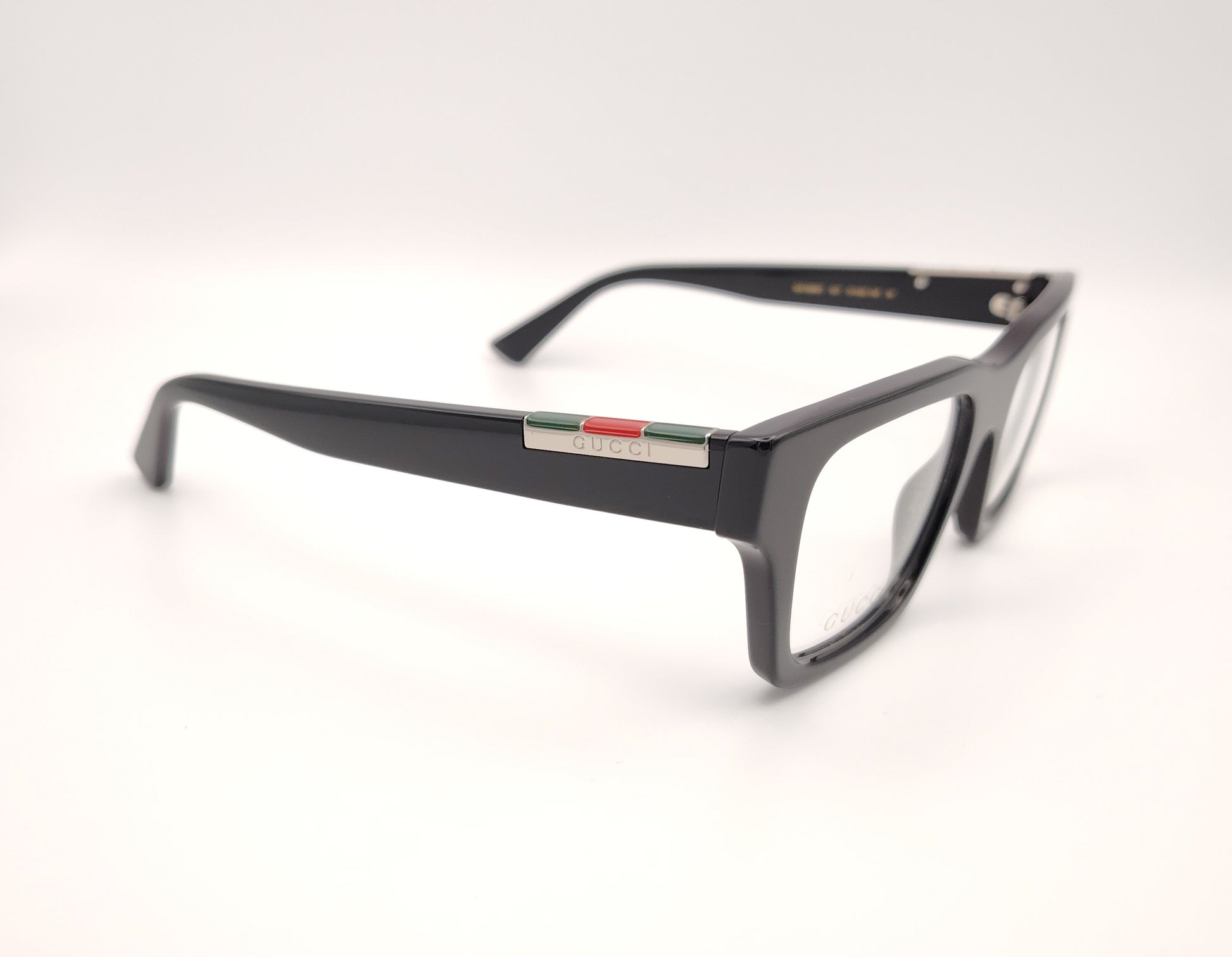 gafas gucci gg1889o 001 rectangulares en acetato negro con detalle metálico en varilla


