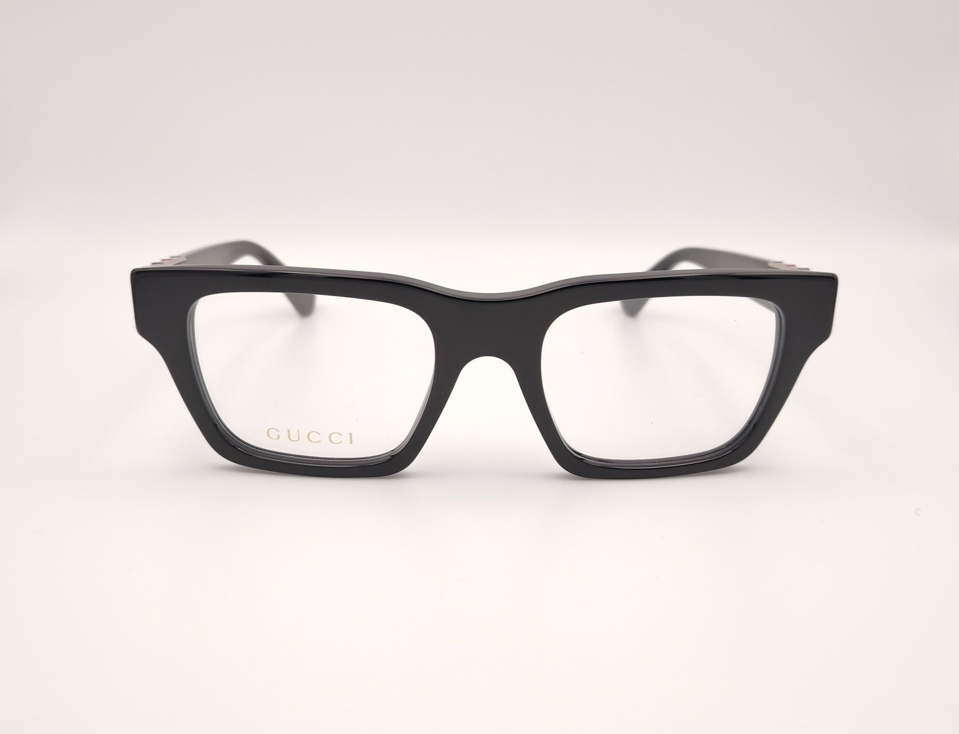gafas gucci gg1889o 001 rectangulares en acetato negro con detalle metálico en varilla

