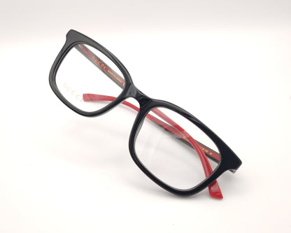 gafas gucci de pasta negra y varillas en rojo y verde con logo dorado