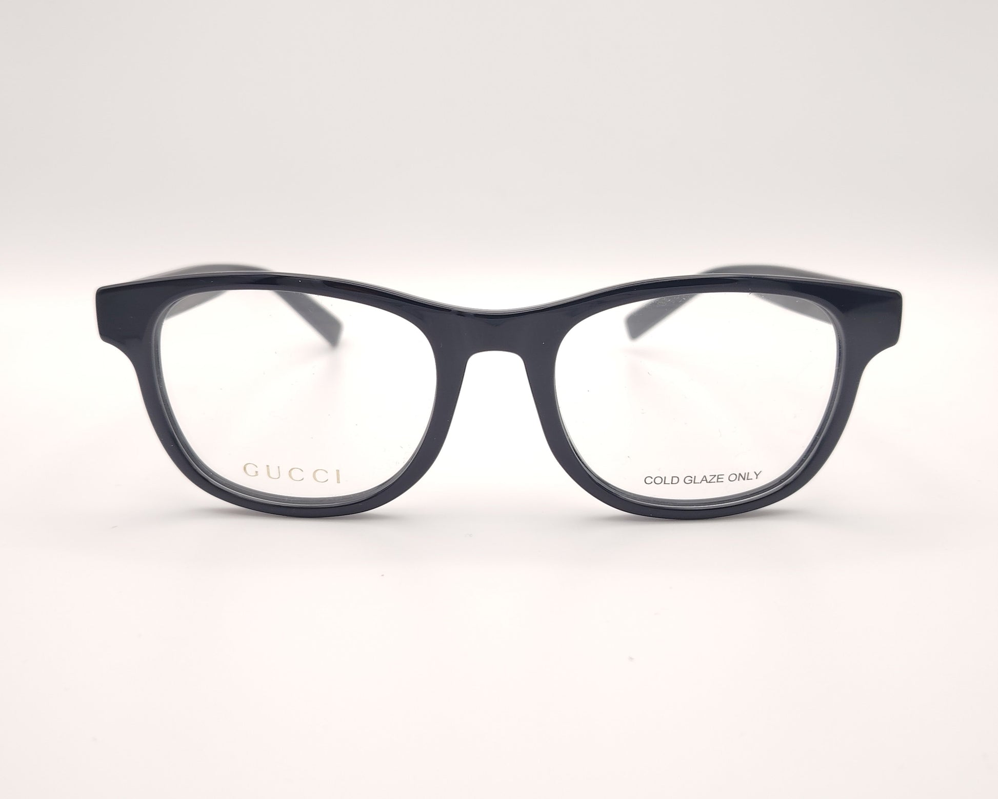 gafas gucci en pasta azul marino con logo dorado en las varillas