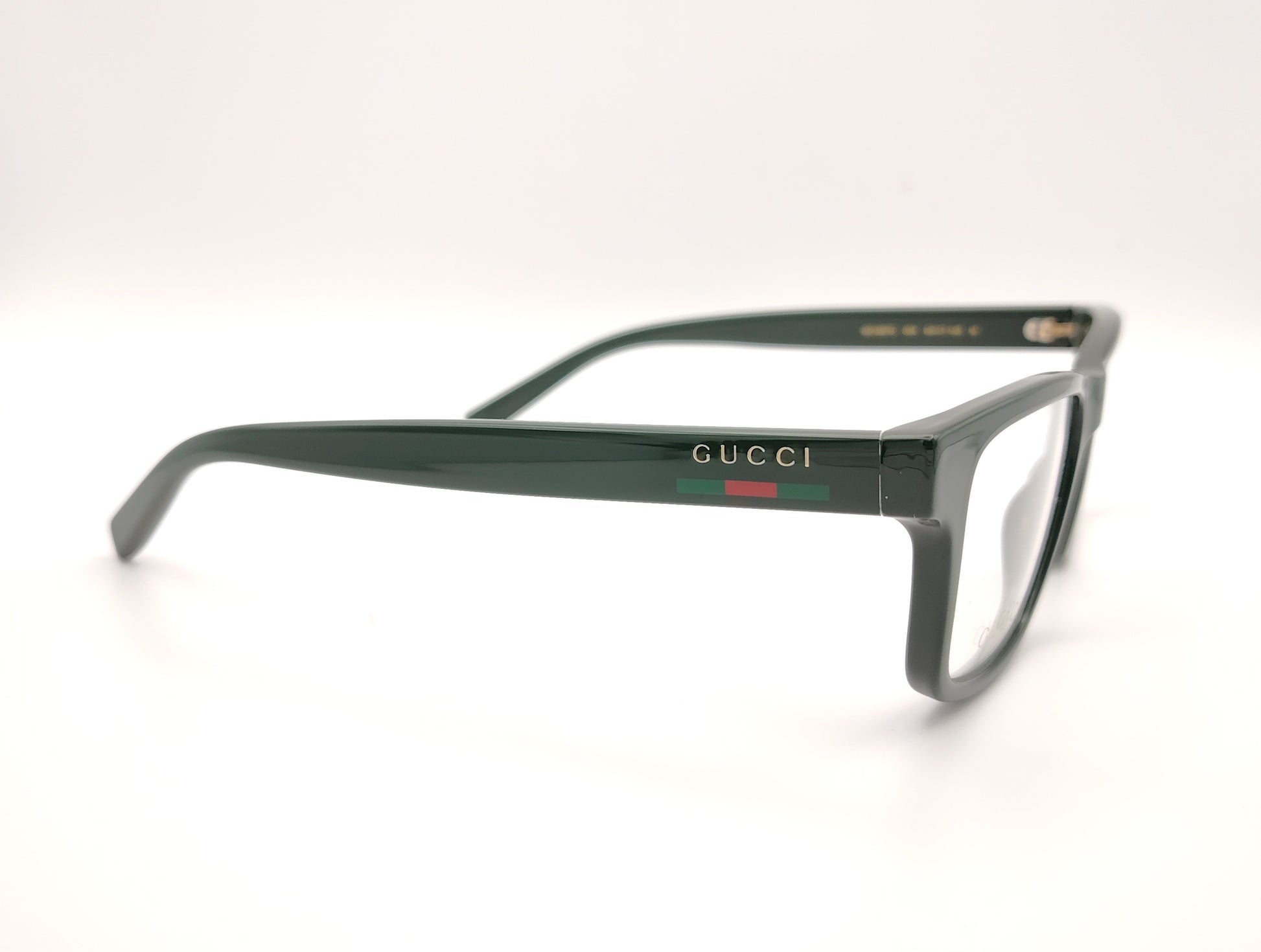 gafas gucci graduadas verde oscuro con forma rectangular y detalle tricolor en la varilla