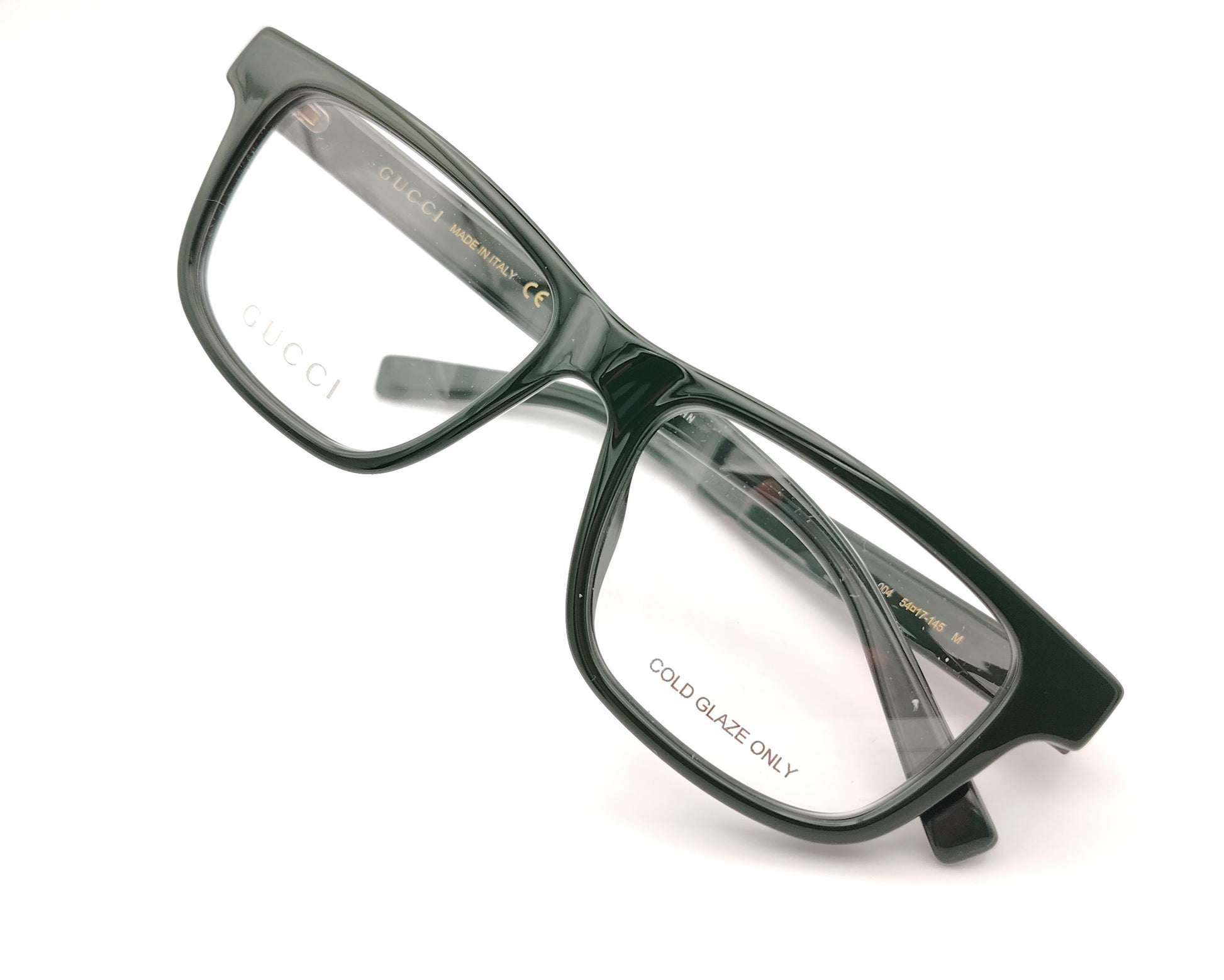 gafas gucci graduadas verde oscuro con forma rectangular y detalle tricolor en la varilla