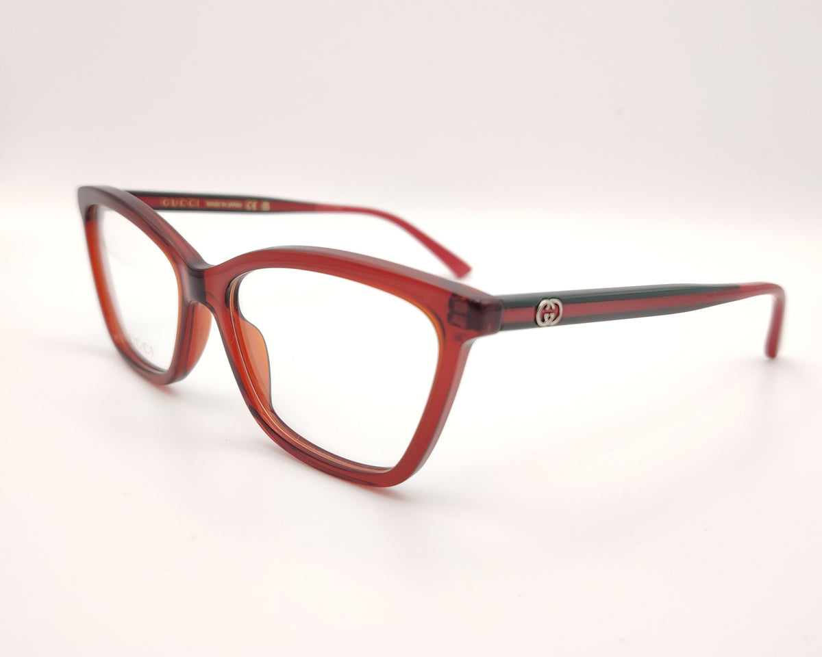 gafas gucci graduadas con montura roja translúcida y detalle gg metálico en las varillas