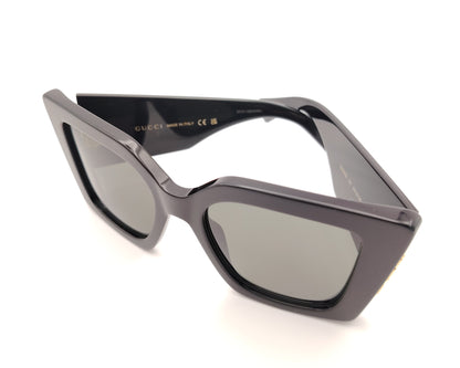 gafas de sol gucci negras oversize cuadradas con logo dorado lateral